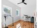 Office with hardwood floors, natural light, a desk, and a bookshelf at 1819 Avon Ave, Atlanta, GA 30311