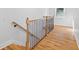 Interior staircase with wood banister and black iron spindles leading to the second floor at 1819 Avon Ave, Atlanta, GA 30311