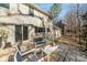 Exterior view of the home with an outdoor patio, showcasing the home's backyard setting at 3762 Frederica Rd, Berkeley Lake, GA 30096