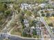 An aerial view showcases neighborhood streets and surrounding lush greenery and landscape at 592 Moreland Ne Ave, Atlanta, GA 30307