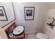 Stylish powder room with modern fixtures, framed artwork, and sleek design at 592 Moreland Ne Ave, Atlanta, GA 30307