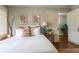 Well-lit bedroom with hardwood floors, neutral decor, and a comfortable aesthetic at 592 Moreland Ne Ave, Atlanta, GA 30307