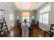 Elegant dining room with coffered ceilings, chandelier, and hardwood floors at 592 Moreland Ne Ave, Atlanta, GA 30307