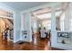Open-concept dining room with coffered ceilings, hardwood floors, and large windows at 592 Moreland Ne Ave, Atlanta, GA 30307
