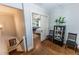 Hallway featuring hardwood floors, staircase, and a glimpse into a bedroom at 592 Moreland Ne Ave, Atlanta, GA 30307