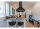 Modern kitchen featuring eat-in bar, stainless steel appliances, and tiled floors at 592 Moreland Ne Ave, Atlanta, GA 30307