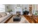 Cozy living room featuring a fireplace, hardwood floors, and stylish decor at 592 Moreland Ne Ave, Atlanta, GA 30307