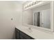 Bathroom with a sink, vanity, and large mirror at 789 Rutland Ct, Lithonia, GA 30058