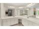 Bright bathroom with dual sinks, a vanity, and ample counter space at 789 Rutland Ct, Lithonia, GA 30058