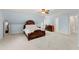 Spacious bedroom with an antique bed and light blue paint at 789 Rutland Ct, Lithonia, GA 30058
