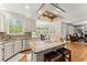 Kitchen island overlooking the dining nook, with stainless appliances, and ample natural light at 789 Rutland Ct, Lithonia, GA 30058