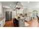 Kitchen with a center island with barstool seating, stainless appliances, and ample cabinetry at 789 Rutland Ct, Lithonia, GA 30058