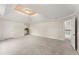 Light-filled bedroom featuring a tray ceiling with an adjacent kitchenette at 789 Rutland Ct, Lithonia, GA 30058