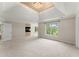Spacious main bedroom featuring a tray ceiling and ample natural light at 789 Rutland Ct, Lithonia, GA 30058