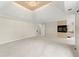 Large main bedroom featuring an elevated ceiling, fireplace, and neutral tones at 789 Rutland Ct, Lithonia, GA 30058