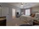 This main bedroom boasts a tray ceiling, plush carpet, and soft, natural light at 2260 Golden Valley Dr, Lawrenceville, GA 30043