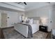 Main bedroom with tray ceilings, dark wood floors, and an ensuite bath at 2422 Tall Timbers Trl, Marietta, GA 30066