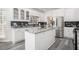 Well-lit kitchen with granite countertops, stainless steel appliances, and mosaic backsplash at 2543 Oak Creek Ln, Conyers, GA 30094