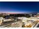 This aerial view shows the city landscape at dusk at 3325 Piedmont Ne Rd # 1504, Atlanta, GA 30305