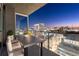 This balcony features a city view, patio furniture, and glass railings at 3325 Piedmont Ne Rd # 1504, Atlanta, GA 30305