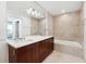 Bathroom featuring double vanity, soaking tub, and marble tile at 3325 Piedmont Ne Rd # 1504, Atlanta, GA 30305