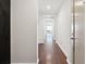 Long hallway with hardwood floors leading to a well-lit area with an abundance of natural light at 3325 Piedmont Ne Rd # 1504, Atlanta, GA 30305