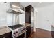 Modern kitchen features stainless steel appliances, range hood, and granite countertops at 3325 Piedmont Ne Rd # 1504, Atlanta, GA 30305