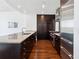 Modern kitchen with stainless steel appliances, dark cabinets and a large island with granite countertops at 3325 Piedmont Ne Rd # 1504, Atlanta, GA 30305
