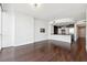 Spacious living room area with hardwood floors and a modern open kitchen at 3325 Piedmont Ne Rd # 1504, Atlanta, GA 30305