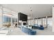 Sun-drenched living room with floor-to-ceiling windows, a sleek fireplace, and a door leading to a patio at 3325 Piedmont Ne Rd # 1504, Atlanta, GA 30305