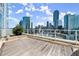 Enjoy breathtaking city views from this spacious wood-decked patio with a clear barrier and city views at 3325 Piedmont Ne Rd # 1504, Atlanta, GA 30305