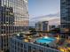 Rooftop swimming pool with city views, lounge chairs and an adjacent deck for relaxing and entertaining at 3325 Piedmont Ne Rd # 1504, Atlanta, GA 30305