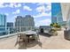 Rooftop area with an outdoor grill, an eating area, and a spectacular city skyline view at 3325 Piedmont Ne Rd # 1504, Atlanta, GA 30305