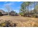 Large, well-kept backyard surrounded by mature trees, providing a sense of seclusion at 426 Lanesborough Dr, Marietta, GA 30064