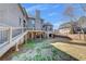 Multi-level deck overlooking a well-maintained backyard and brick design elements in the home's foundation at 426 Lanesborough Dr, Marietta, GA 30064