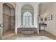 Bathroom features a soaking tub with arched window, walk-in shower, and vanity at 426 Lanesborough Dr, Marietta, GA 30064