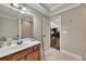 Bathroom featuring tiled floors and walls, a vanity with a sink, and a large mirror at 426 Lanesborough Dr, Marietta, GA 30064