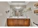 Bathroom with a single sink vanity with wooden cabinets and a large mirror at 426 Lanesborough Dr, Marietta, GA 30064