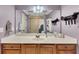 Bathroom featuring a well-lit vanity, a framed mirror, and a shower through the door at 426 Lanesborough Dr, Marietta, GA 30064