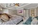 Bedroom with a large bed, seating area, ensuite bathroom, and contemporary decor at 426 Lanesborough Dr, Marietta, GA 30064
