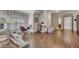 Bonus room with hardwood floors, work desk near a window, and sofa with decorative pillows at 426 Lanesborough Dr, Marietta, GA 30064