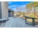 A spacious wooden deck with a metal railing and a table with chairs offers outdoor living at 426 Lanesborough Dr, Marietta, GA 30064