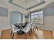 Elegant dining room with wainscoting, designer lighting, and ample natural light at 426 Lanesborough Dr, Marietta, GA 30064