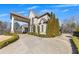 Elegant two-story brick home with mature landscaping and a circular driveway at 426 Lanesborough Dr, Marietta, GA 30064