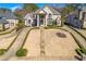 Impressive brick home with a manicured lawn and a grand entrance with stately columns at 426 Lanesborough Dr, Marietta, GA 30064