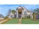 Stately brick home with a covered front porch, featuring elegant columns and landscaped grounds at 426 Lanesborough Dr, Marietta, GA 30064