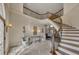 Grand foyer with a curved staircase, chandelier, and high ceilings creating an inviting entrance at 426 Lanesborough Dr, Marietta, GA 30064