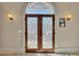 Front entrance of home featuring decorative glass doors with arched transom window at 426 Lanesborough Dr, Marietta, GA 30064