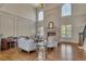 Bright living room featuring high ceilings, fireplace, hardwood floors, and many windows at 426 Lanesborough Dr, Marietta, GA 30064