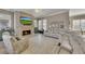 Inviting living room featuring a stone fireplace, ceiling fan, and large sectional sofa at 426 Lanesborough Dr, Marietta, GA 30064